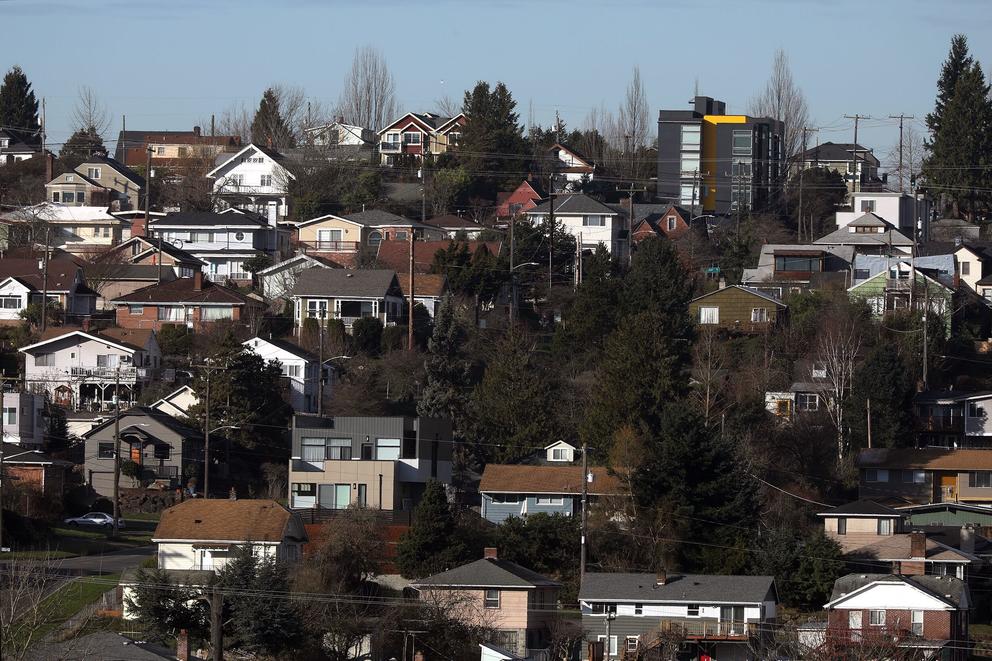 lots of houses on a forested hillside in seattle