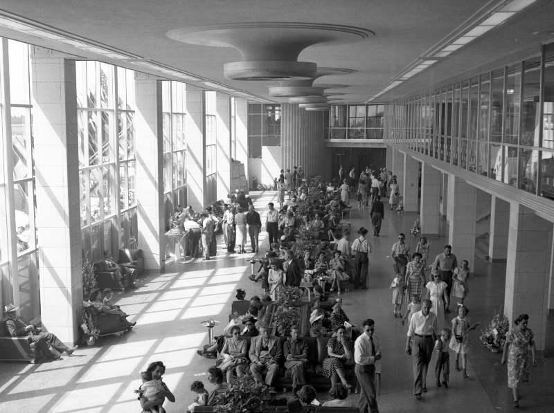 Travelers pass through the SEA Airport in 1949