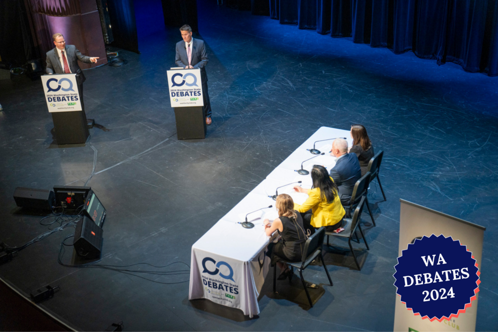 the candidates and moderators on the stage