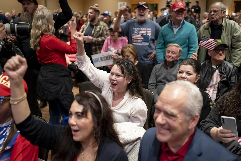Attendees cheer during a Washington State Republican Party election night party