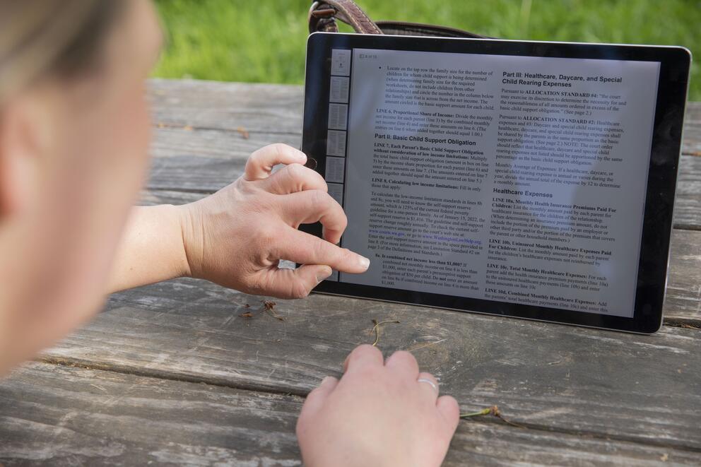 close up shot of finger scrolling on ipad