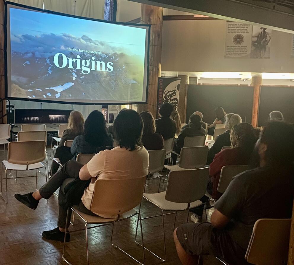 People gather at a screening for "Origins: The Last Reefenetters"