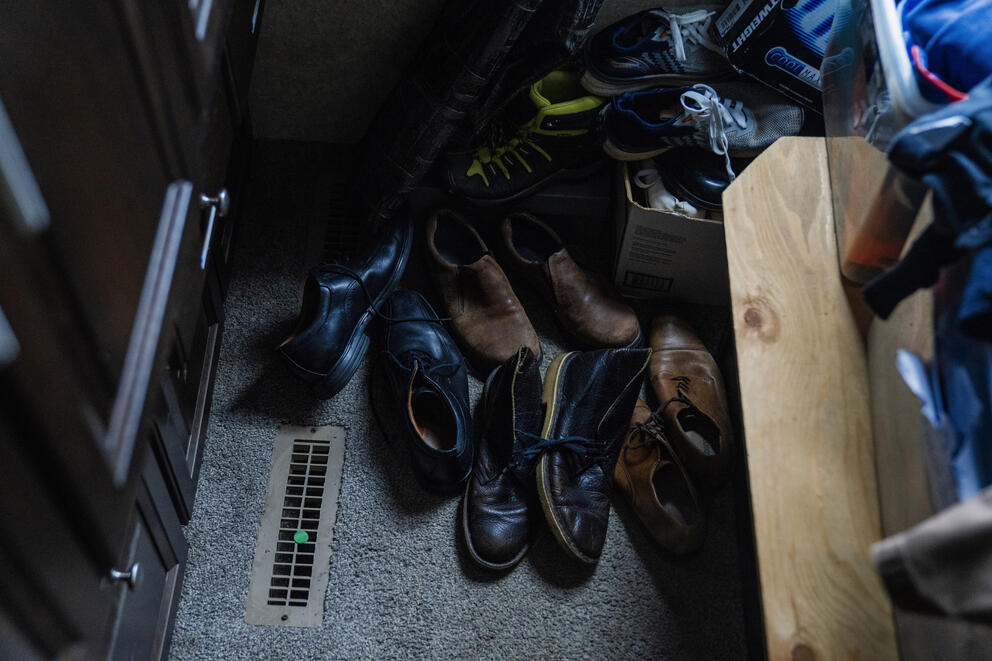 A pile of shoes sit available for detainees if needed