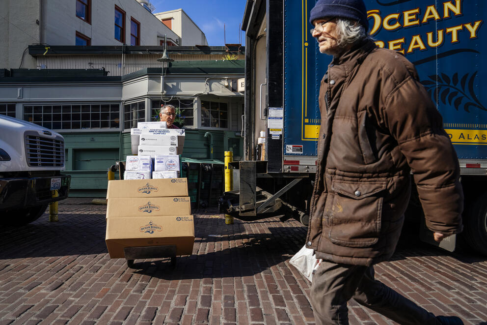 Troy Terry (left) delivers seafood