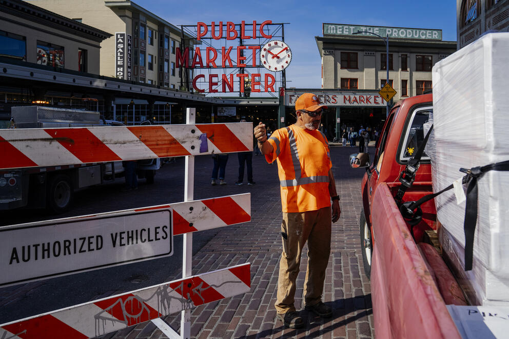 SDOT worker Cid Rodriguez moves a temporary barrier 