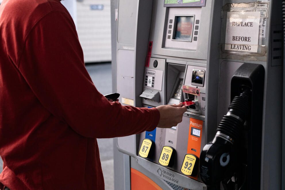A person pumps gas.