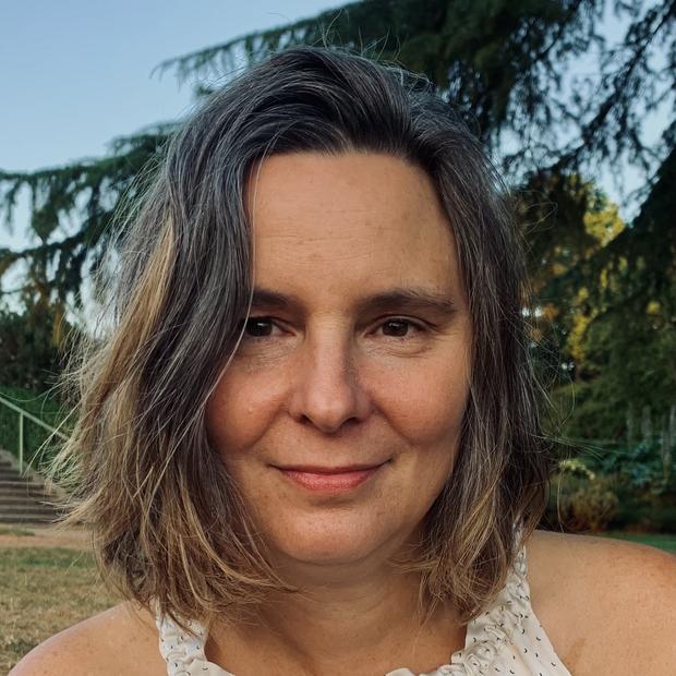 Woman looking toward camera.