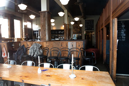 Empty tables inside a restaurant closed by the pandemic