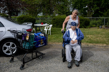 Gina gets help with her wheelchair