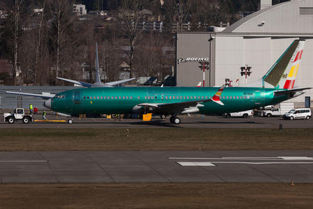 Boeing plane is shown on a tarmac
