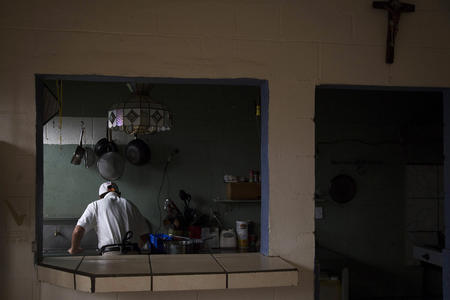 a man works in the kitchen