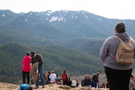 Hikers explore Rattlesnake Ledge in North Bend, WA, March 22, 2020. For months, local and state officials have urged residents to avoid recreation in the outdoors to help prevent the spread of COVID-19. As summer approaches, many campgrounds are opening for the season, and with it, some hikers fear poor social distancing and crowded trails may help the virus spread. (Jen Dev/Crosscut)