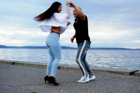 Jim Chow spins students at beach