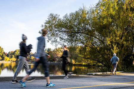 Joggers in a park without masks