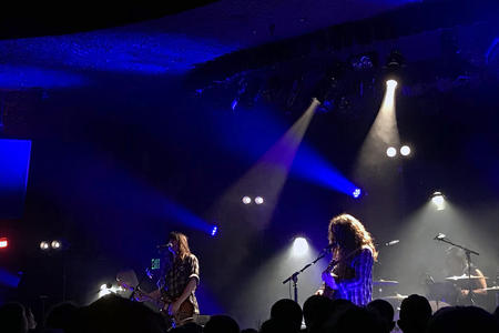 Two musicians performing onstage