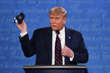 Trump holding a mask