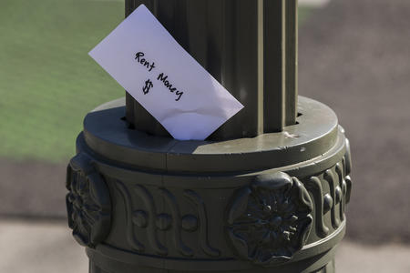 envelope that reads 'rent money'