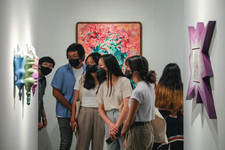 People mingle and browse through the galleries at the Seattle Art Fair
