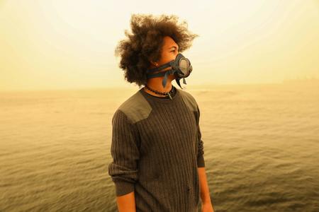 Person on the shore with gasmask