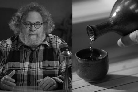 Host Knute Berger with sake being poured into a cup