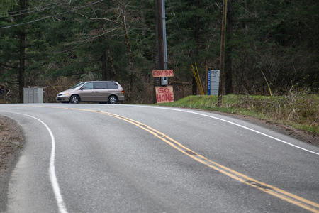 A sign in North Bend, WA reads "COVID-19. Go home."