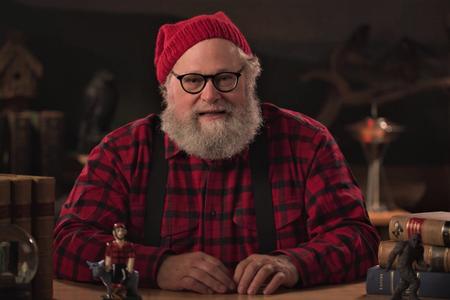 Host Knute Berger in Paul Bunyan logging attire.