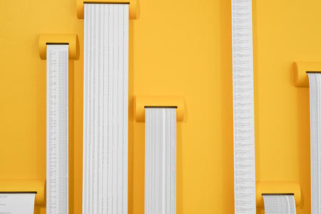 yellow wall with scrolls of text