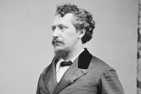 profile photo of a 19th century man in a suit and tie