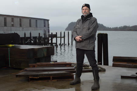 Geno Leech stands for a portrait at historic Pier 39 in Astoria.