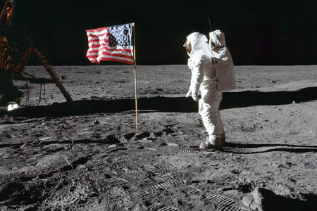 Astronaut Edwin E. Aldrin Jr., lunar module pilot of the first lunar landing mission, poses for a photograph beside the deployed United States flag during an Apollo 11 extravehicular activity (EVA) on the lunar surface, July 20, 1969. (Photo by Neil A. Armstrong via NASA)