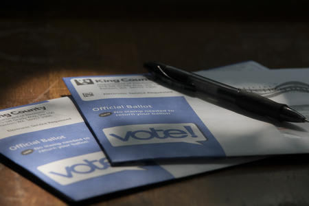 enveloped ballots sit on a table