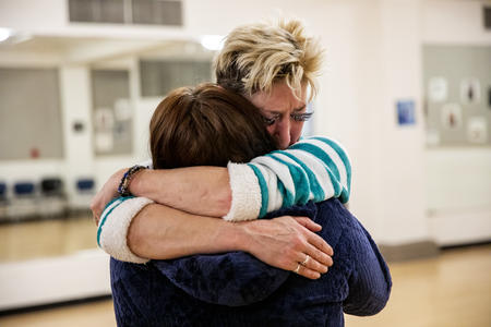 Jana Hill hugs Amy Lambert backstage
