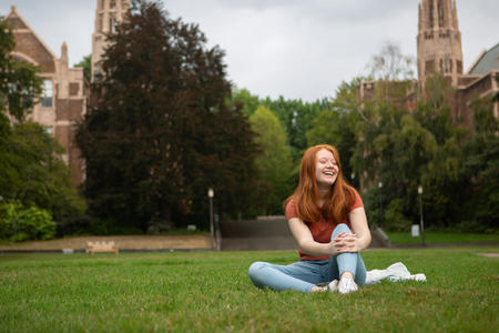 Main character of the new documentary "Senior Year was Crazy" sits in the grass