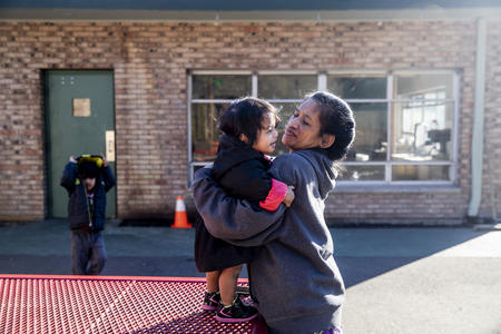 Mother holding child outside