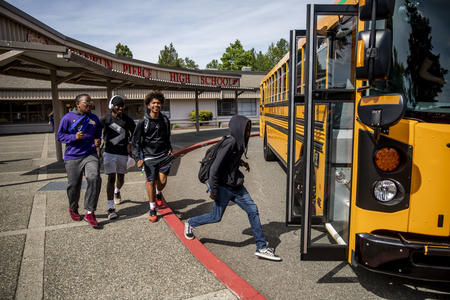 Kids running on to a bus