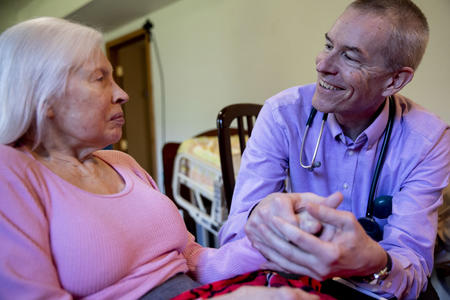 Dr. Peter Lehmann visits with Alzheimer's patient Maureen O'Tool, 81, in her Kingston home on March 19, 2019.