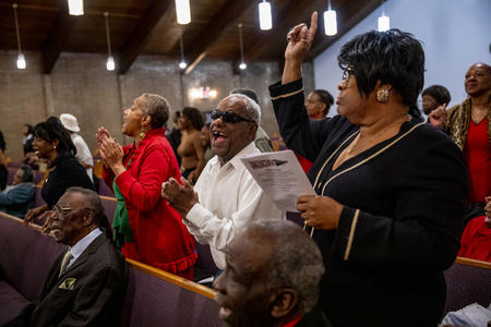Congregation members sing