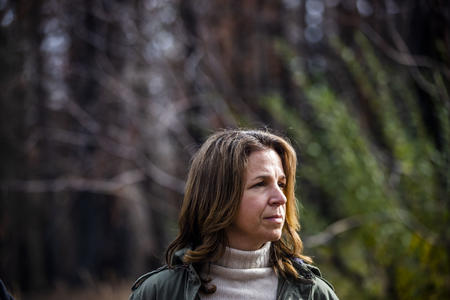 Washington State Lands Commissioner Hilary Franz at the site of the 2017 Jolley Mountain Fire on Wednesday, Oct. 24, 2018. The Department of Natural Resources is implementing a forest health treatment plan which uses sections of dying forest for cross laminated timber. Franz says this plan will also help keep the cost of wildfire suppression down and make forests more resilient to wildfires. (Photo by Dorothy Edwards/Crosscut)