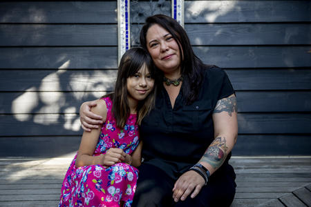 Eveline Ishisaka, 10, in her Greenwood home on Aug. 15, 2019. In March Ishisaka was dress-coded for wearing the dress pictured. (Photo by Dorothy Edwards/Crosscut)