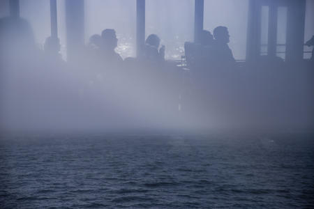 A reflection of whale watchers seen through the window of the Puget Sound Express traveling from the Port of Edmonds along the Puget Sound on Friday, Oct. 19, 2018