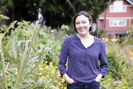 woman standing in a p-patch