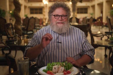 Host Knute Berger enjoys a crab Louis at Spokane's Davenport Hotel.