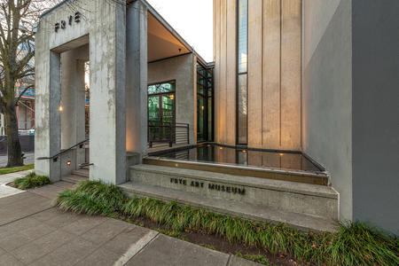 museum entrance featuring concrete and water feature