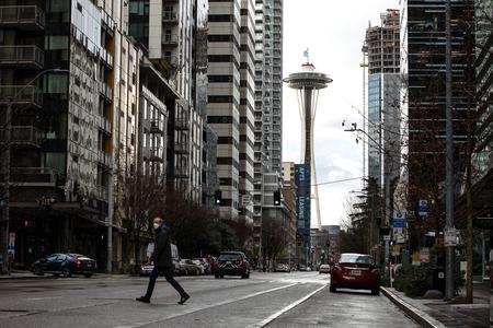 man walking across the street.