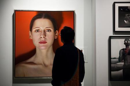 Person standing in front of artwork