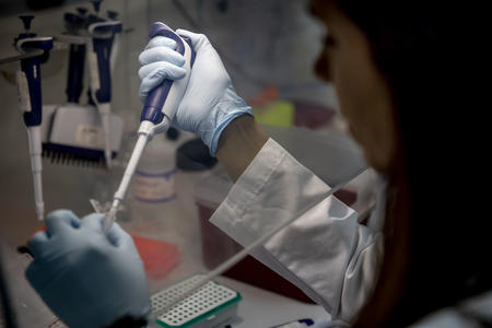 Intellectual Ventures researcher Corrie Ortega works on control sampling as a part of her cervical cancer research on June 17, 2019. (Photo by Dorothy Edwards/Crosscut)