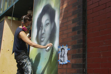 Artist Mari Shibuya paints a mural of Breonna Taylor