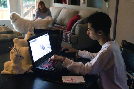 Peyton uses a laptop