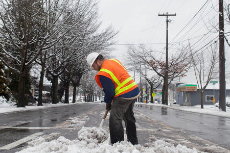 seattle DOT employee shovels snow