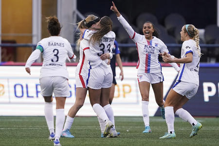Soccer players celebrating on the pitch